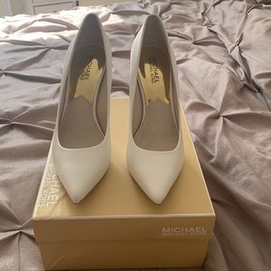 Michael Kors white heels.